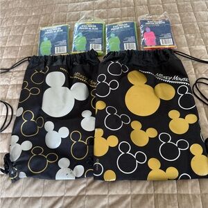 Theme park ready kit, 2 MM Drawstring Bags, 2 Clip and Go’s, & 4 rain ponchos.